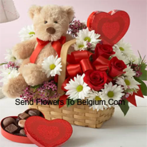 A Beautiful Basket Made Of Red Roses, White Gerberas And Seasonal Fillers, An Imported Box Of Chocolate And A Cute Brown Teddy Bear
