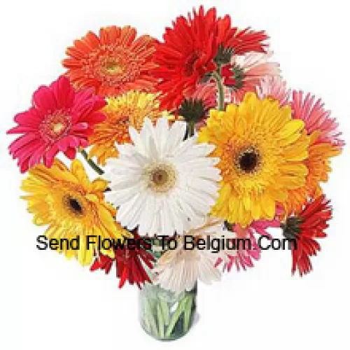 19 Mixed Colored Gerberas With Some Ferns In A Glass Vase